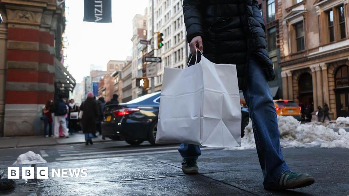 A shopper carries a bag in the SoHo neighborhood of New York, US, on Friday, Feb. 13, 2026.