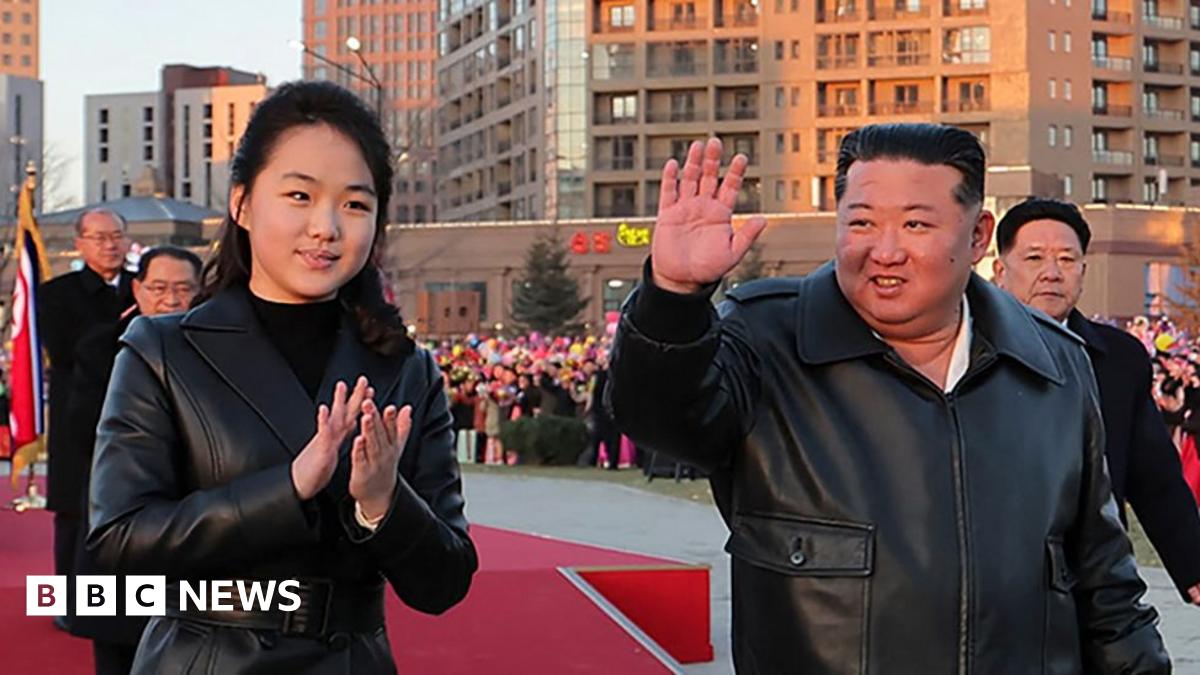 This picture taken on February 16, 2026 and released by North Korea's official Korean Central News Agency (KCNA) on February 17, 2026 shows North Korean leader Kim Jong Un (C) and his daughter Ju Ae (L) responding to citizens at the inauguration ceremony of 10,000 flats at fourth stage in Hwasong area of Pyongyang.