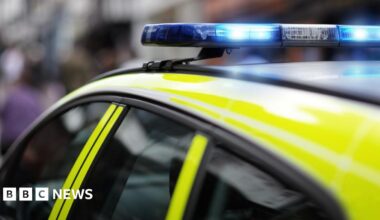 Top of police car with blue light on.