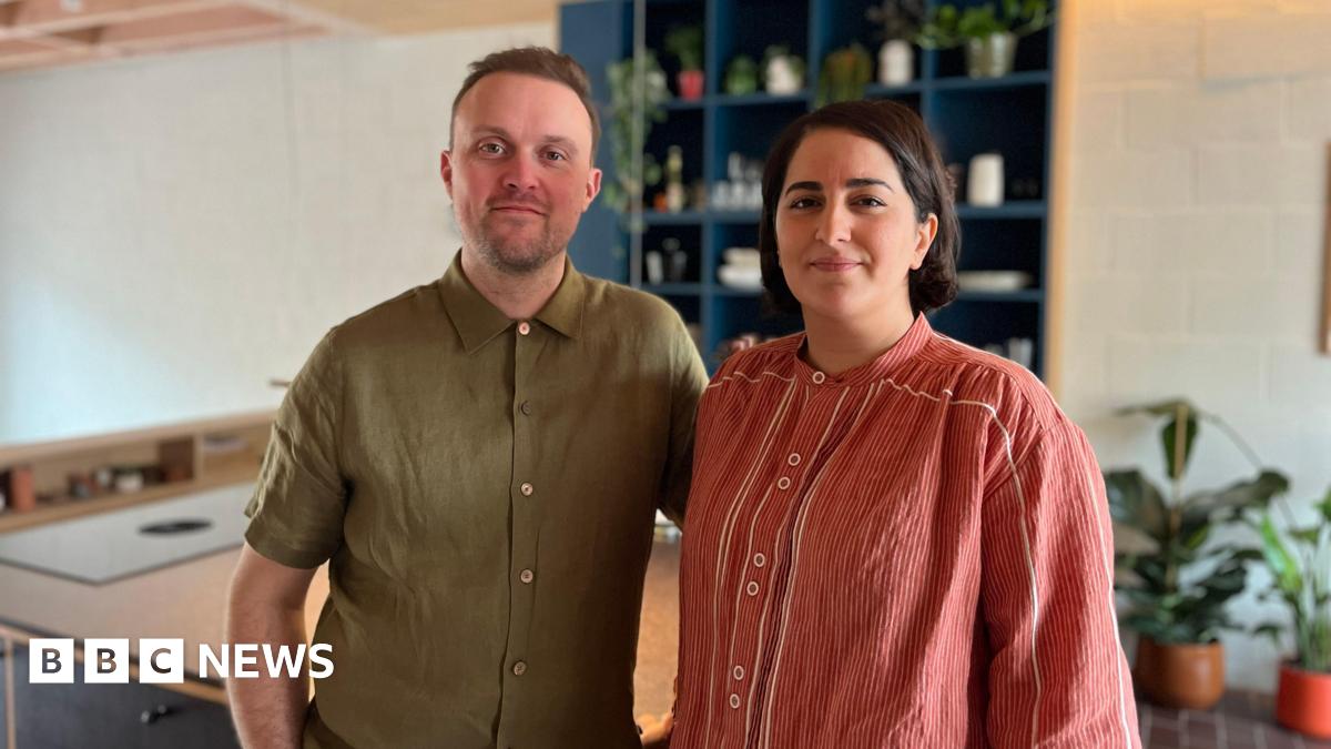 Picture of Will and Sogand Howard in their kitchen
