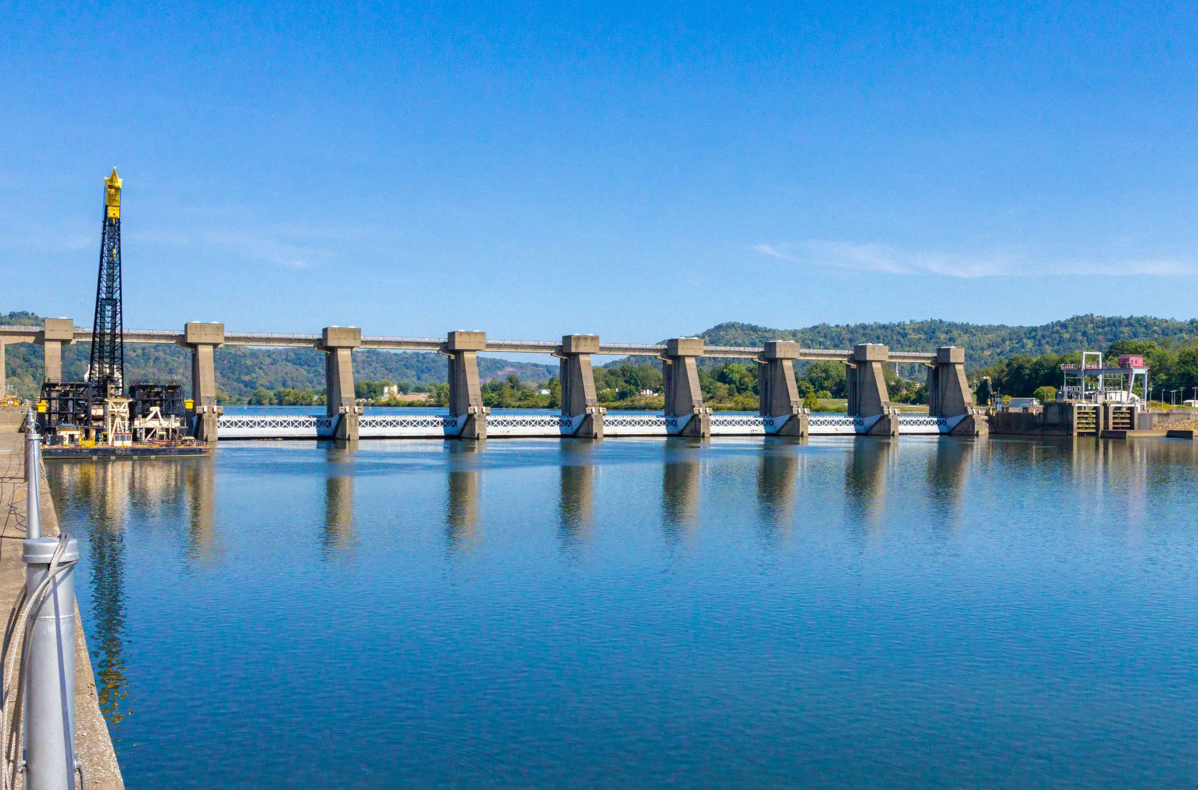 The Henry M. Shreve floating heavy crane parked alongside the primary lock chamber's river wall at Hannibal Locks and Dam.