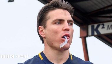 Head and shoulders of Catalans Dragons player Zac Lipowicz with his gumshield hanging from his mouth