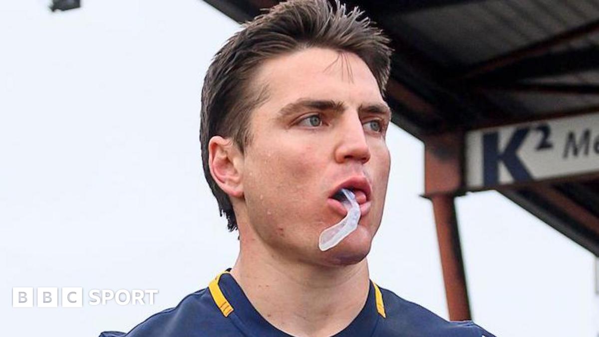 Head and shoulders of Catalans Dragons player Zac Lipowicz with his gumshield hanging from his mouth