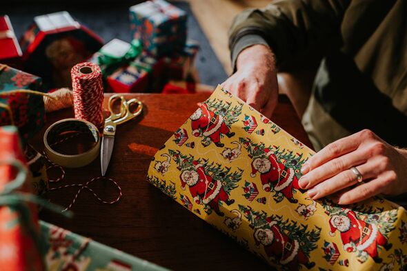 Image depicting gift wrapping, giving, generosity, and the festive Christmas period and tradition of giving presents at Christma