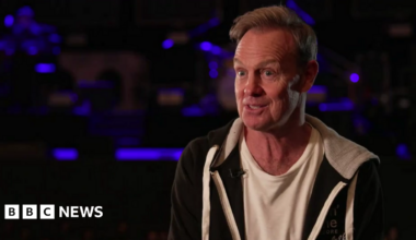 A man, Jason Donovan, sat in a theatre.