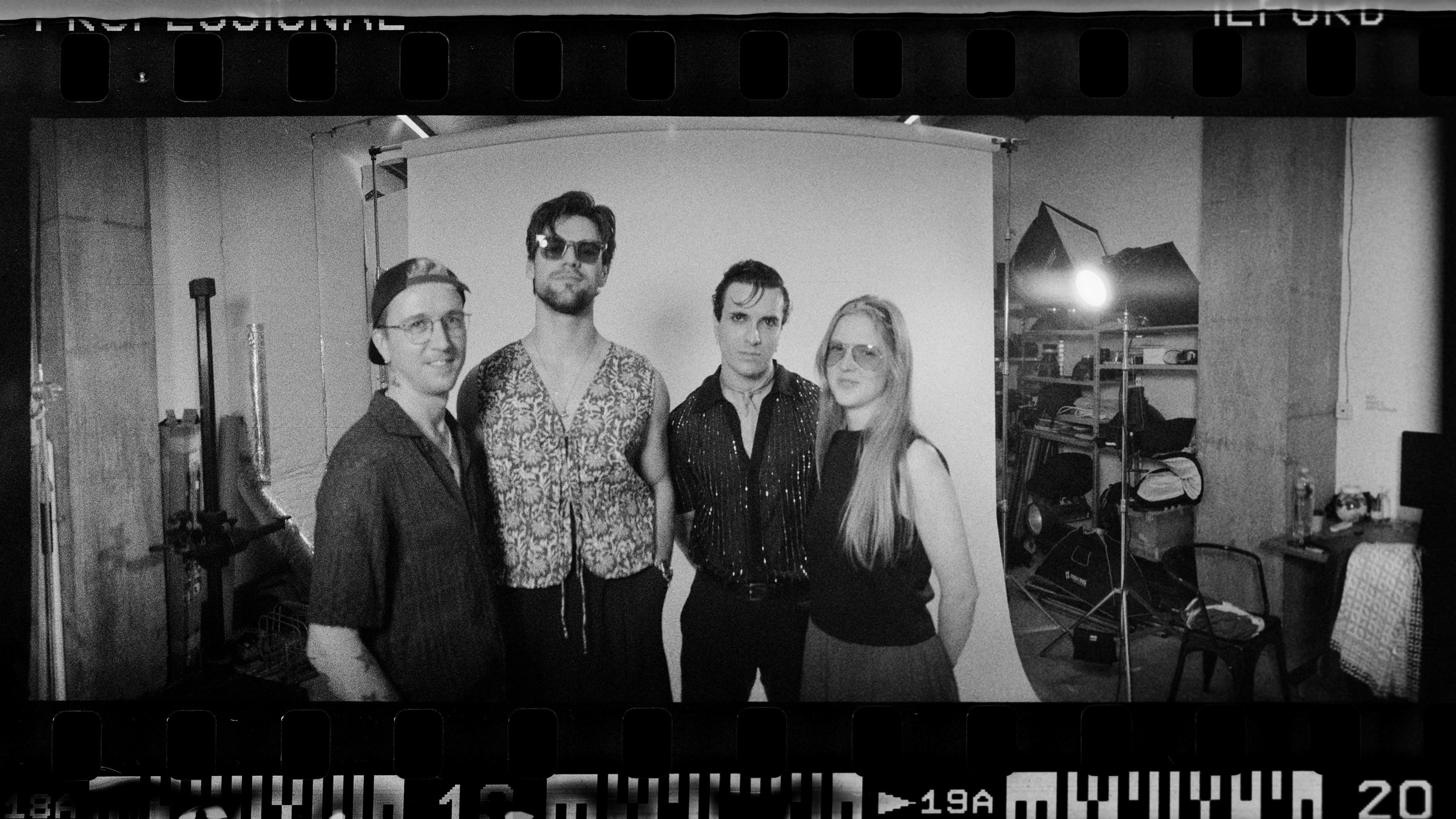 A band rehearsing in a studio.