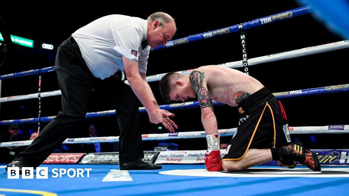Phil Edwards counts a knocked down Lee Clayton during a boxing match