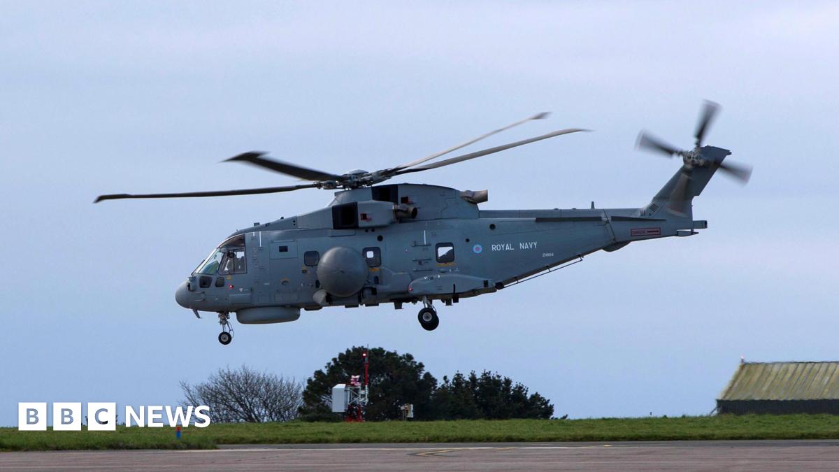 The Royal Navy Merlin Mk2 helicopter taking off from RNAS Culdrose on Saturday. It is on a concrete runway on a clear day.