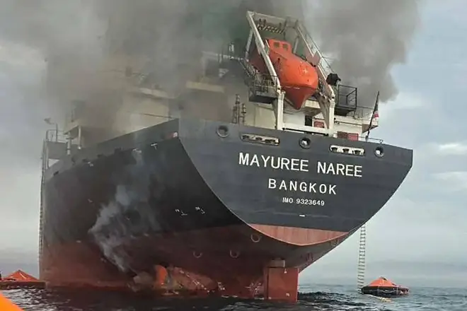 Smoke rising from the Thai bulk carrier 'Mayuree Naree' near the Strait of Hormuz after an attack