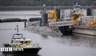 A submarine sitting in the water at Faslane.