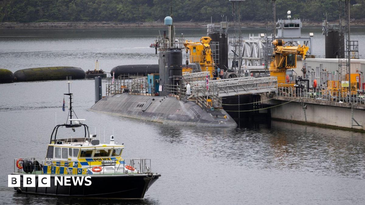 A submarine sitting in the water at Faslane.