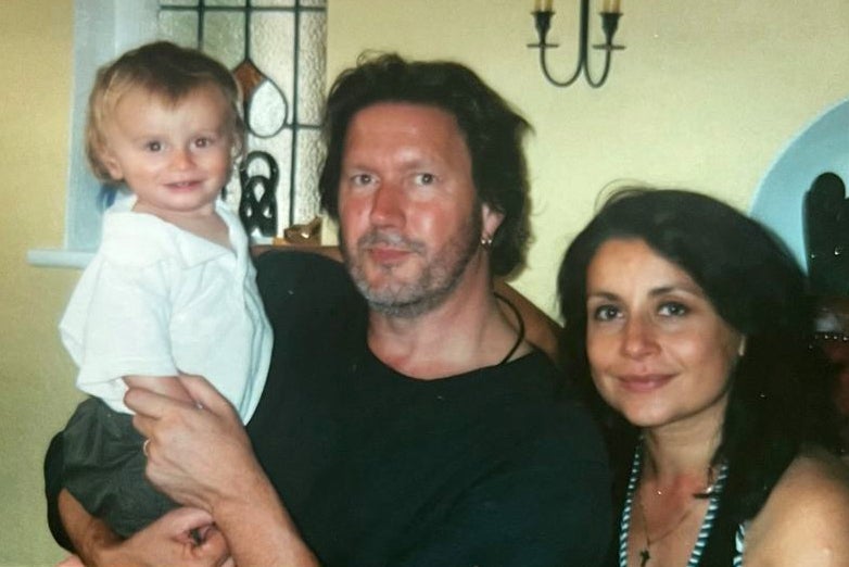 Alex as a baby with his parents