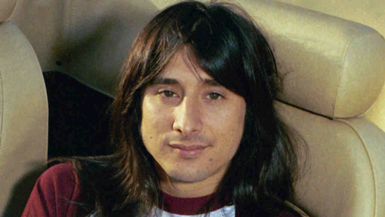 Steve Perry of Journey posing for a photograph in 1980