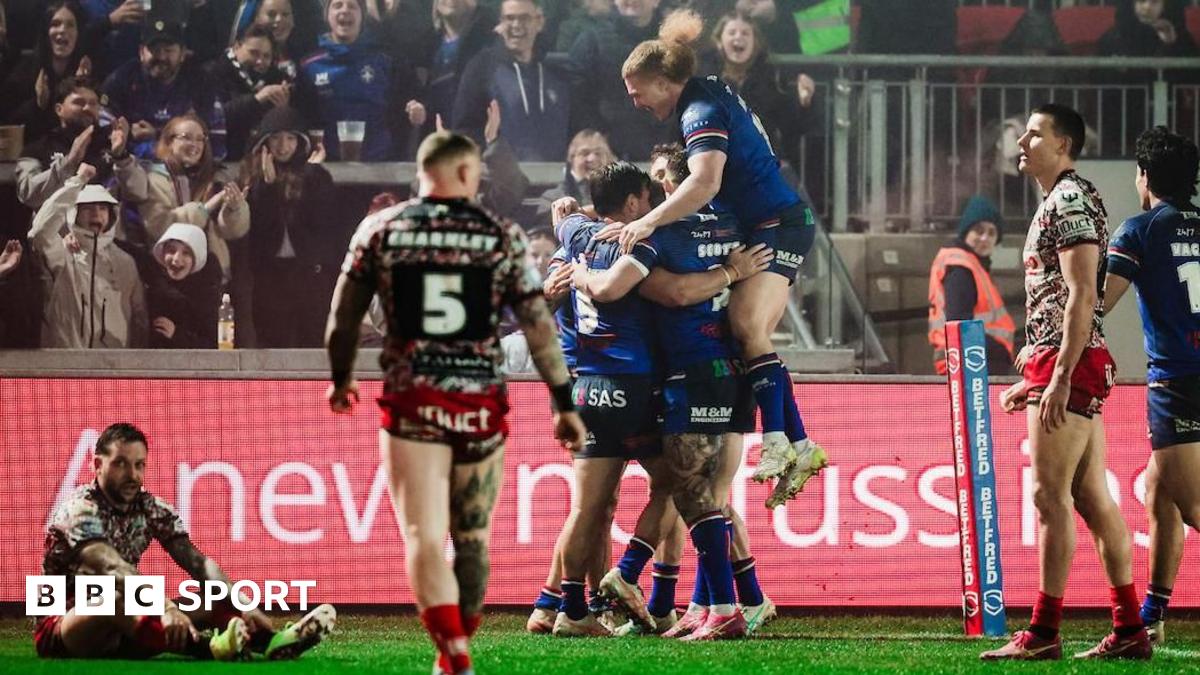 Wakefield players embrace Jayden Myers after his try early in the second half against Leigh