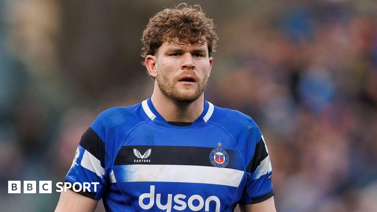Ethan Staddon standing on the pitch during a match wearing Bath kit
