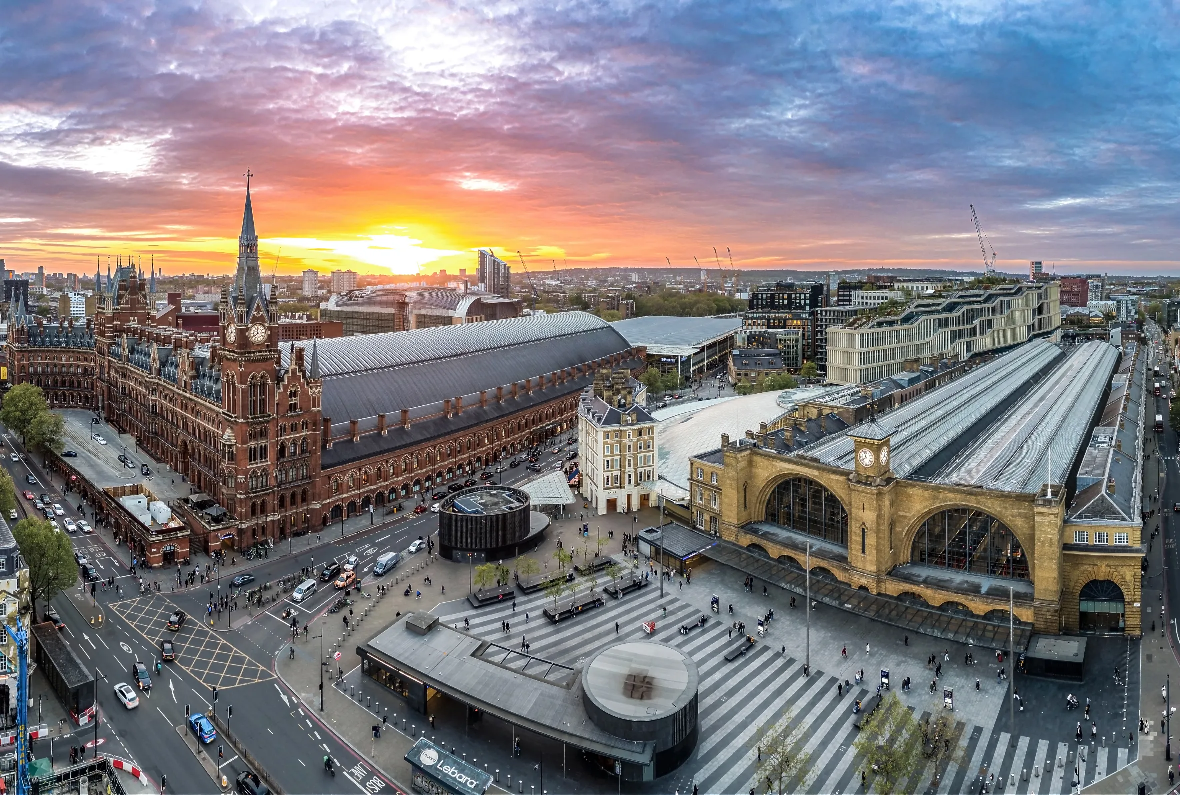 Aerial view of St Pancras International, King's Cross, and the Google UK Headquarters at sunset.