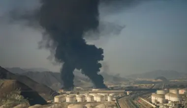 Fire and plumes of smoke rise from an oil facility in Fujairah, United Arab Emirates, Saturday, March 14, 2026. (AP Photo/Altaf Qadri)