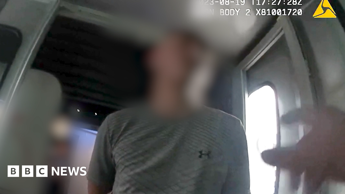 Arooj Shah, with shoulder-length dark hair and wearing a black top, speaks in a BBC TV studio.