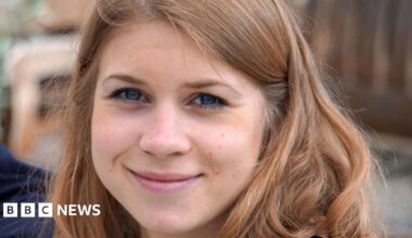 A close-up photograph of Sarah Everard, a young woman with brown hair, smiling at the camera.
