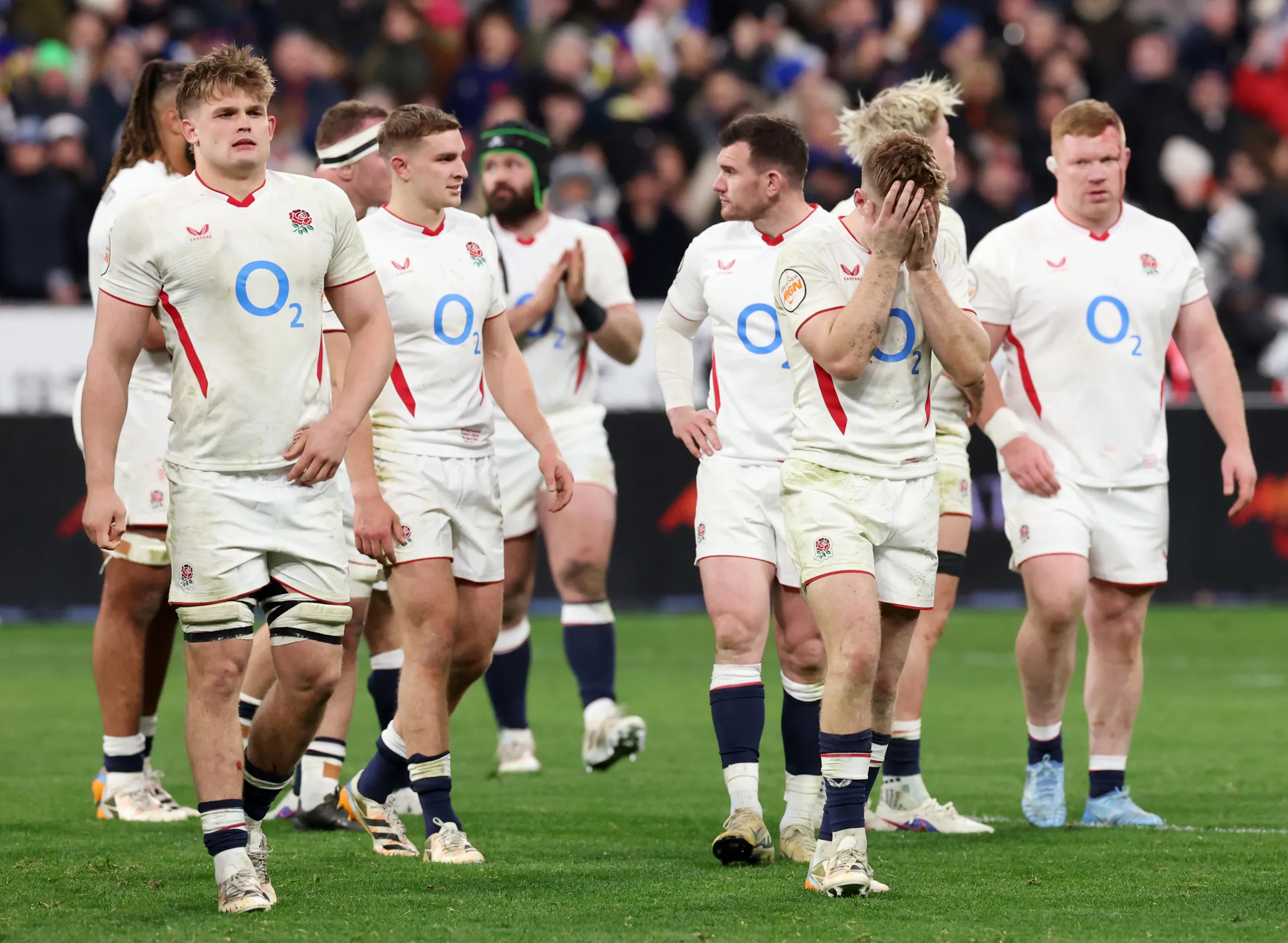 Guy Pepper and Fin Smith of England looking dejected after a rugby match.