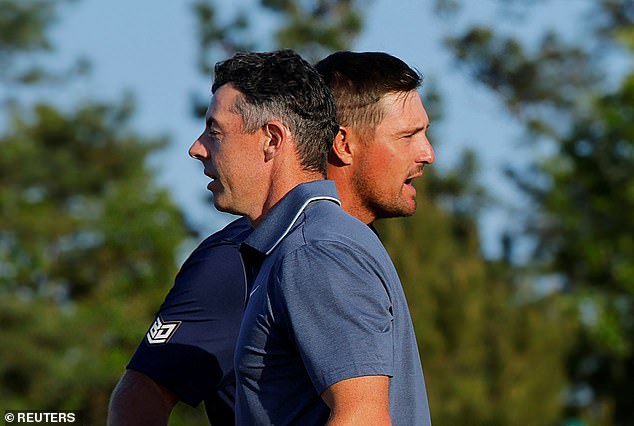The American (back) claimed that McIlroy (front) refused to talk to him throughout the round