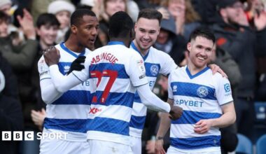 QPR's players celebrate a goal in front of their fans