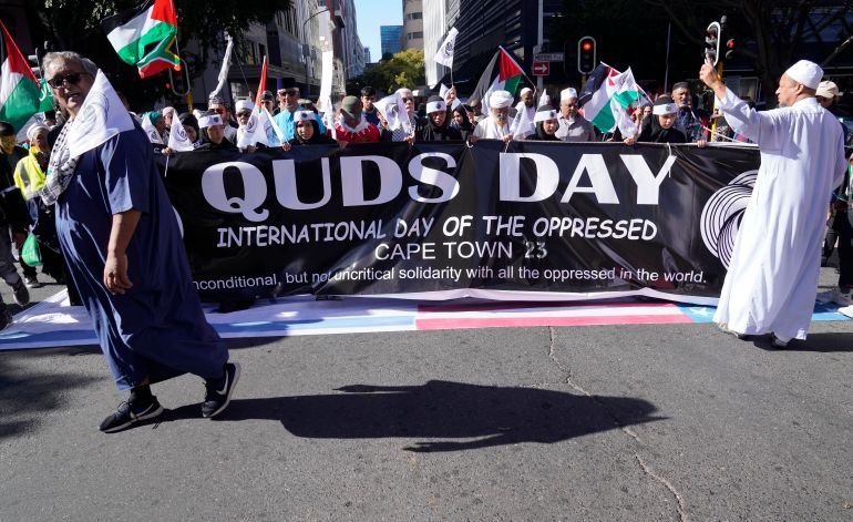 Quds Day banner held by demonstrators