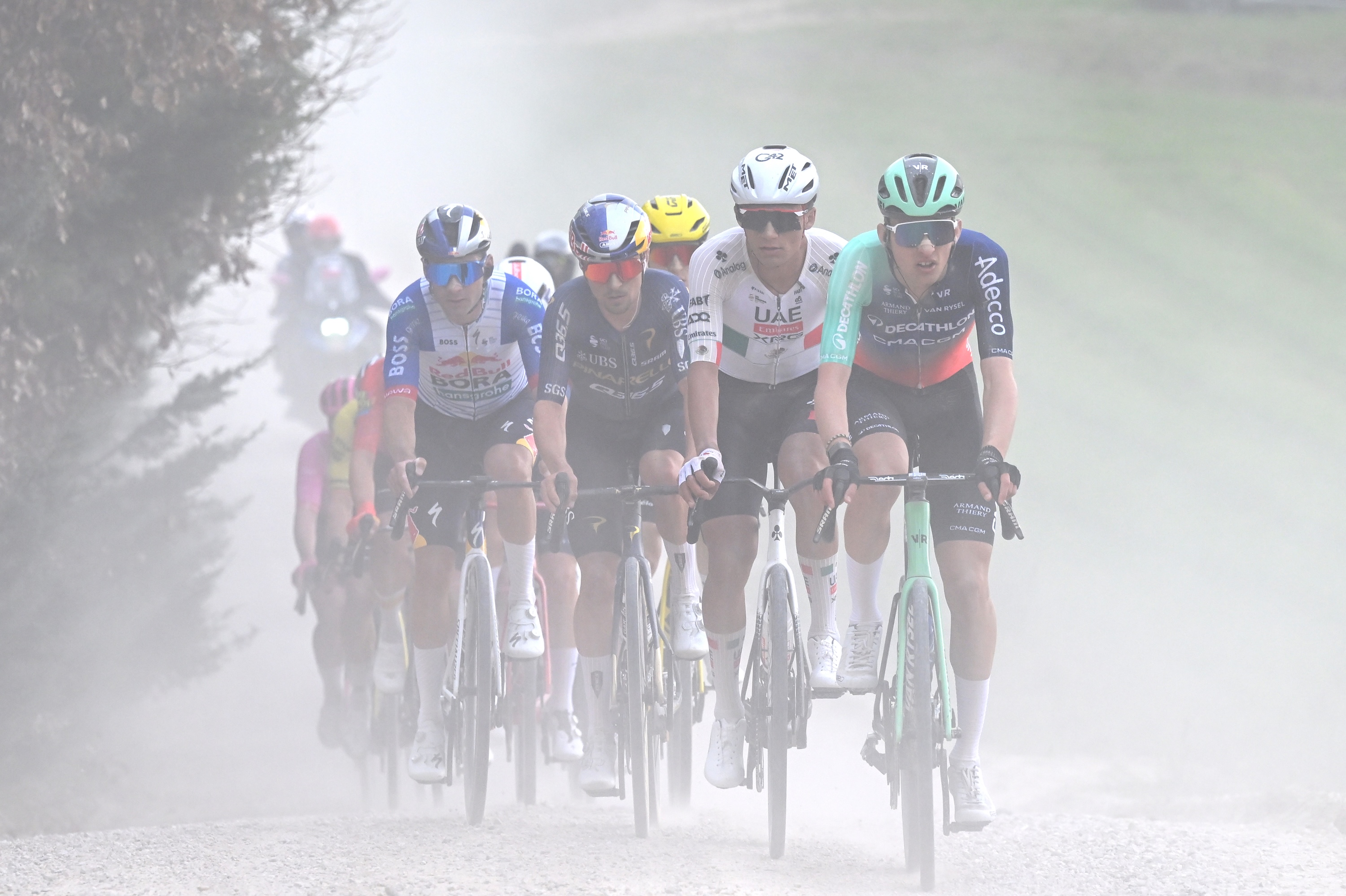 SIENA, ITALY - MARCH 07: (L-R) Thomas Pidcock of Great Britain and Team Pinarello Q36.5 Pro Cycling, Isaac Del Toro of Mexico and UAE Team Emirates - XRG and Paul Seixas of France and Team Decathlon CMA CGM compete in the chase group during the 20th Strade Bianche 2026 a 203km one day race from Siena to Siena / #UCIWT / on March 07, 2026 in Siena, Italy. (Photo by Tim de Waele/Getty Images)