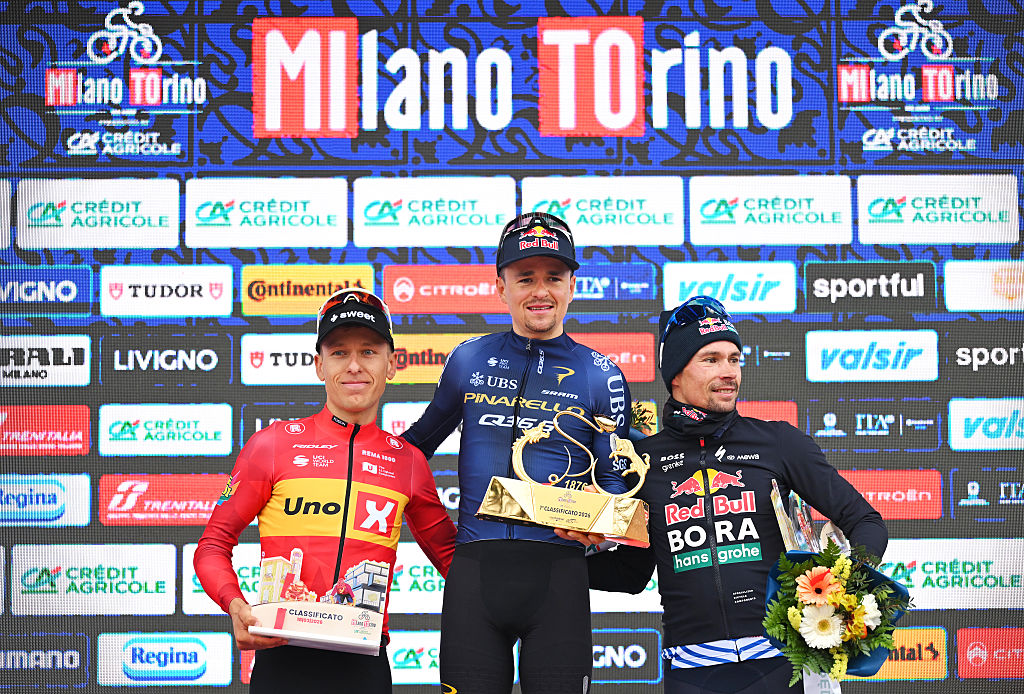 TURIN, ITALY - MARCH 18: (L-R) Tobias Halland Johannessen of Norway and Team Uno-X Mobility on second place, race winner Thomas Pidcock of Great Britain and Team Pinarello Q36.5 Pro Cycling and Primoz Roglic of Slovenia and Team Red Bull - BORA - hansgrohe on third place pose on the podium ceremony after the 106th Milano-Torino 2026 a 174km one day race from Rho to Turin - Superga 670m / #UCIWT / on March 18, 2026 in Turin, Italy. (Photo by Tim de Waele/Getty Images)