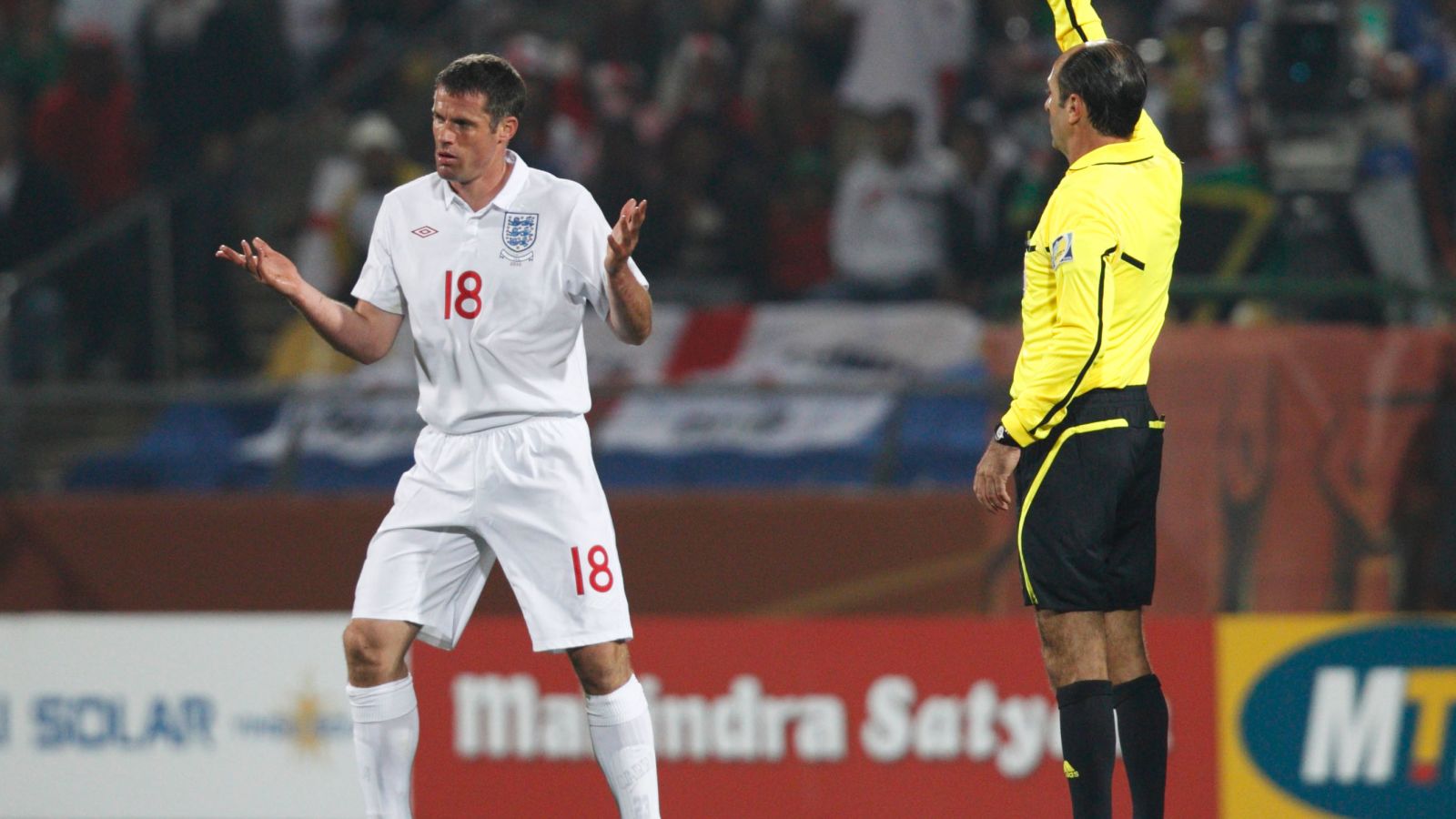 Jamie Carragher is booked at the 2010 World Cup