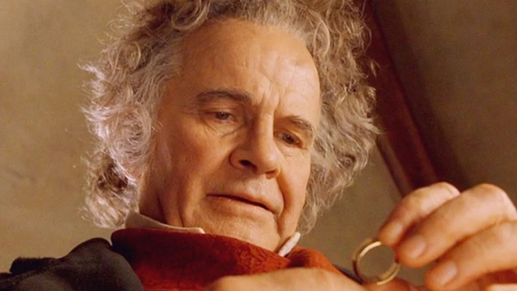 Bilbo Baggins holding the One Ring in The Lord of the Rings.