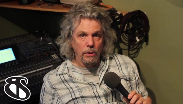 Close up of Bob Power speaking into a microphone