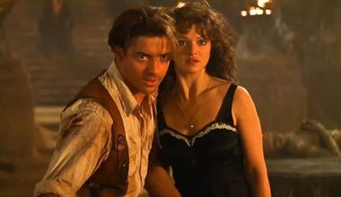 Brendan Fraser lunges for something while Rachel Weisz stays back
