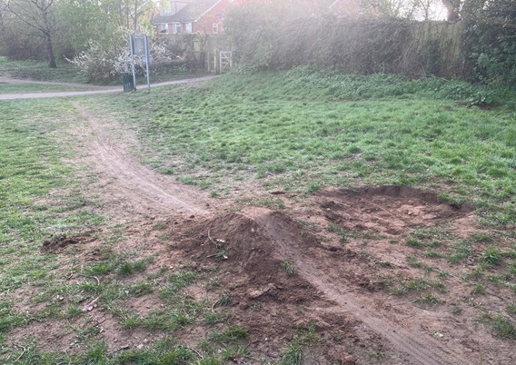 Children create small bike ramp in Twyford park