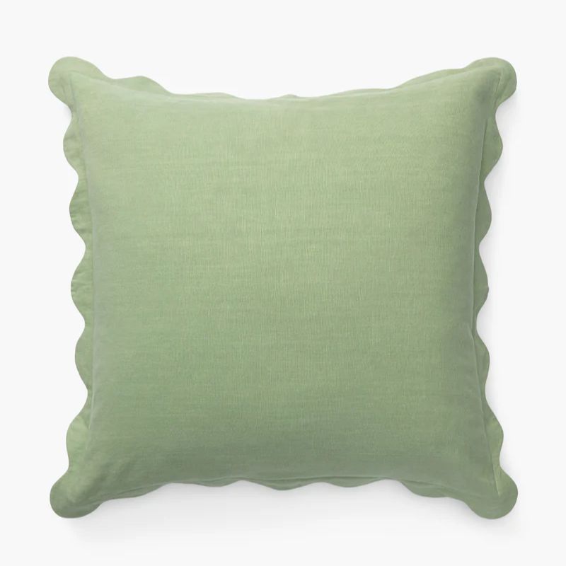 light green cushion with scalloped edge