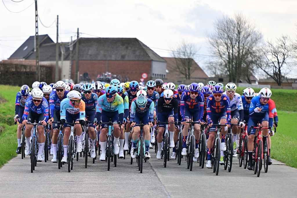 The pack of riders pictured in action during the 78th edition of the men elite race of the Kuurne-Brussels-Kuurne one day cycling race, 195 km from Kuurne to Kuurne via Brussels, Sunday 01 March 2026. BELGA PHOTO DIRK WAEM (Photo by DIRK WAEM / BELGA MAG / Belga via AFP)