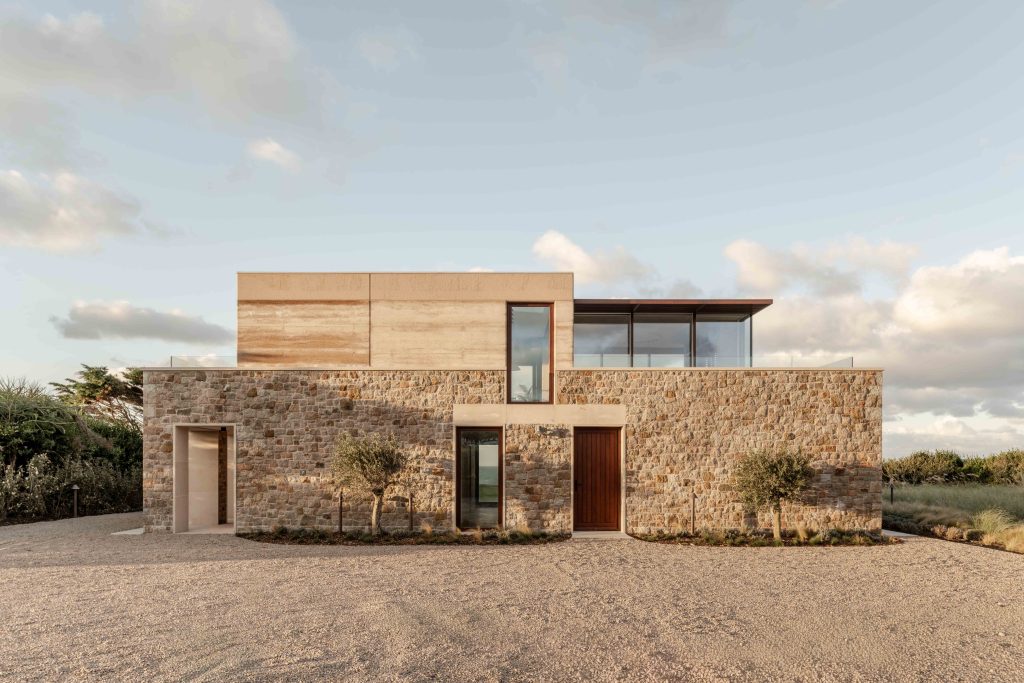 Fieldwork completes rammed-earth house in Jersey