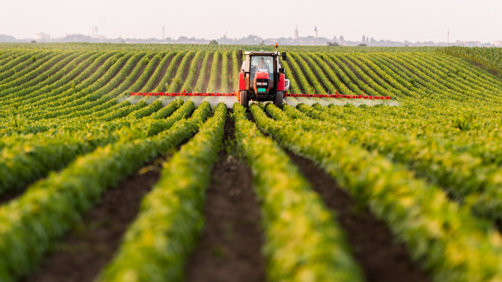 tractor fertilising the fields