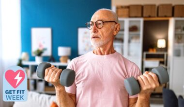 a senior man holding two dumbbells