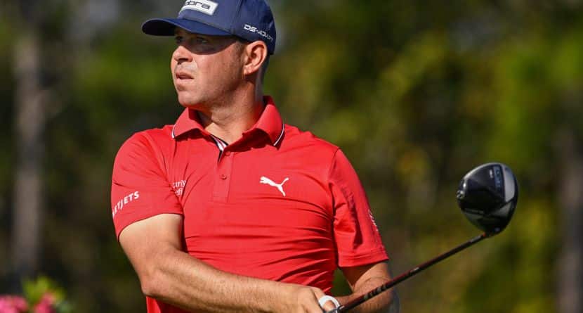 Gary Woodland looks on after hitting his tee shot on the second hole during the final round of the PNC Championship golf tournament, Dec. 21, 2025, in Orlando, Fla. (AP Photo/Phelan M. Ebenhack)