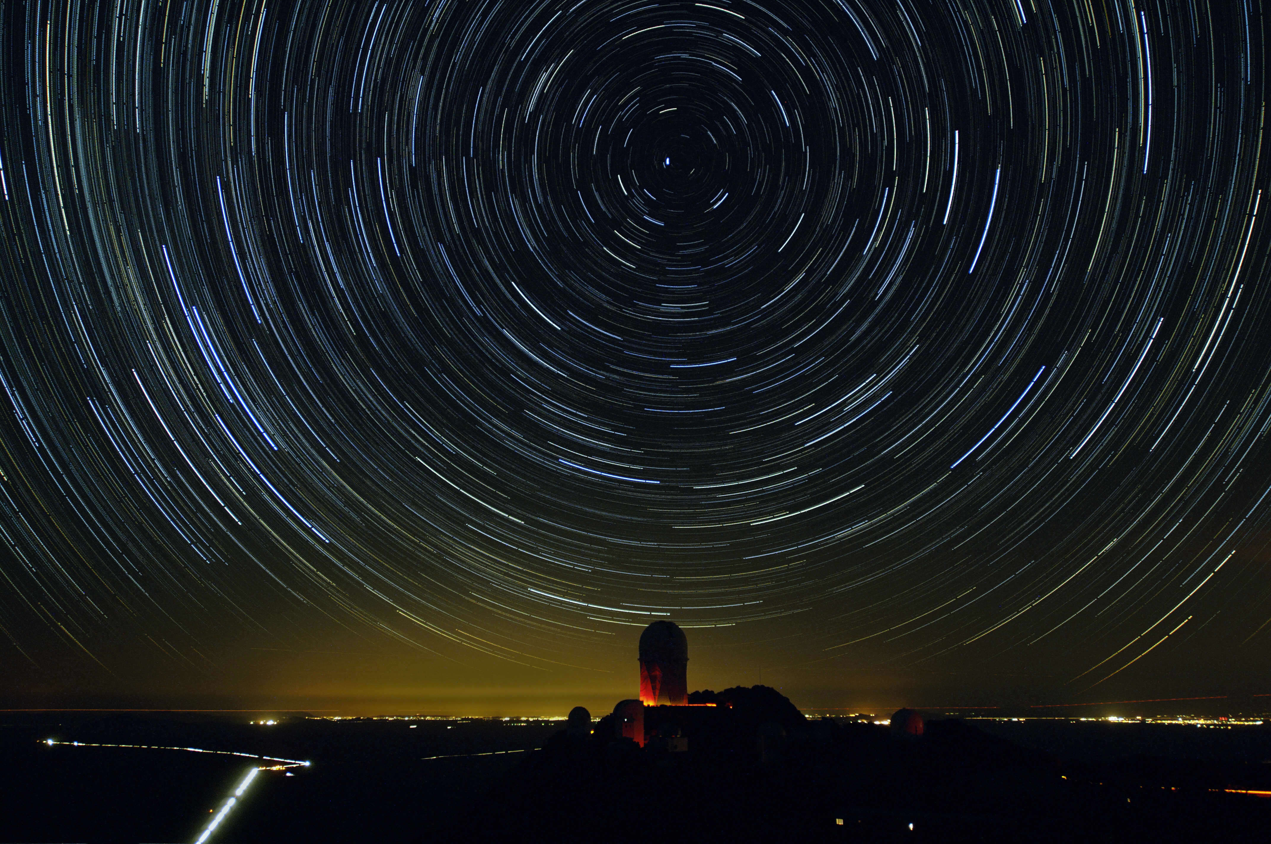 Stars appear to rotate around the Kitt Peak National Observatory in Tucson, Arizona, in January 2026. Physicians and scientists warn that star-blocking light from satellites in low-Earth orbit could harm our sleep health