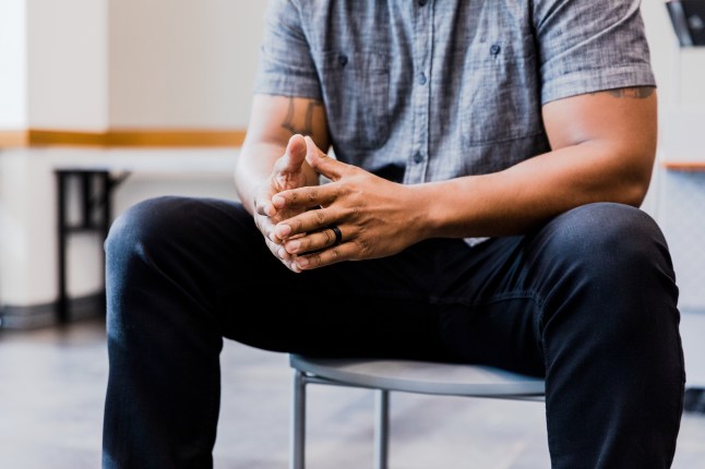 Unrecognizable man experiences emotional stress
