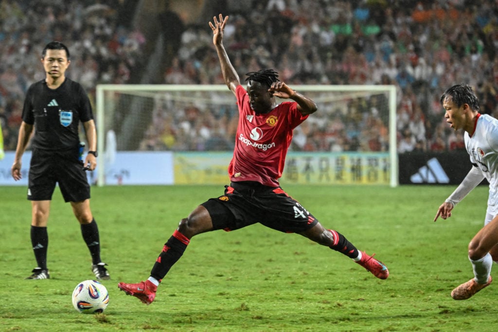 Sekou Kone lunges for the ball in action for Manchester United.