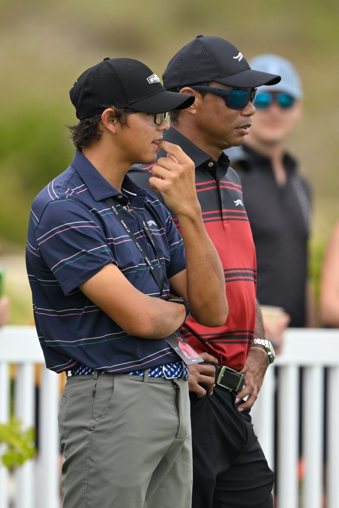 Charlie Woods (l.) and dad Tiger (r.) at the Hero World Challenge in December 2025.