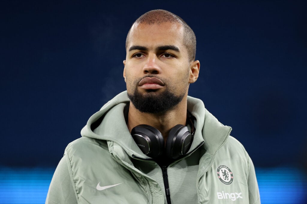 Robert Sanchez inspects the pitch