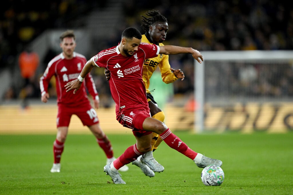 Cody Gakpo and Matheus Mane battle for the ball during Liverpool's Premier League match against Wolverhampton Wanderers at Molineux