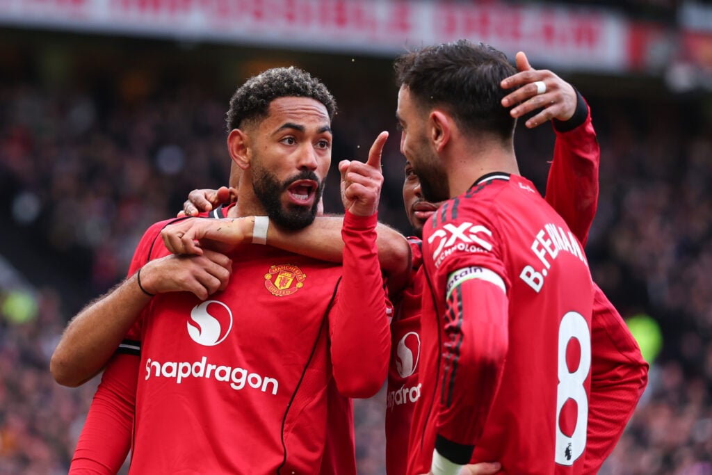 Matheus Cunha celebrates scoring their second with Bruno Fernandes during the Premier League match between Manchester United and Aston Villa at Old Trafford in 2026 in Manchester, England.