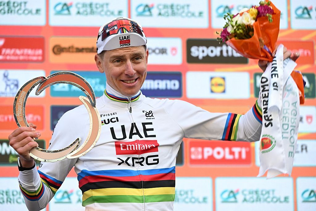 Slovenian Tadej Pogacar of UAE Team Emirates-XRG celebrates on the podium after winning the