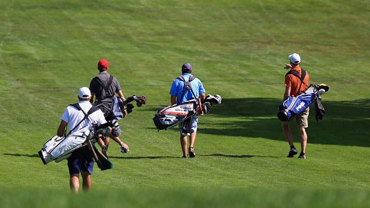 Golfers walking | Source: Getty Images
foursomes