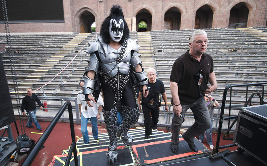 Danny Francis walks to the stage with Gene Simmons